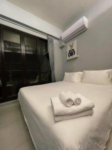 Ein Bett oder Betten in einem Zimmer der Unterkunft Donggang Homestay-Dongfan