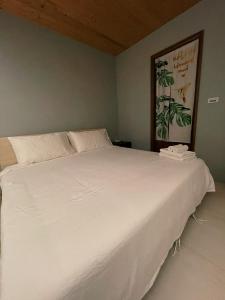Ein Bett oder Betten in einem Zimmer der Unterkunft Donggang Homestay-Dongfan