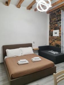 Postel nebo postele na pokoji v ubytování 5 Terre Station Rooms + 8 fotografií