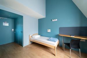 Cama o camas de una habitación en Adveniat Paris