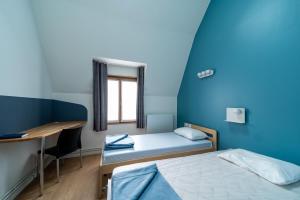 Cama o camas de una habitación en Adveniat Paris