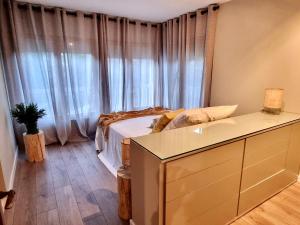 A bed or beds in a room at Tierra Boutique, Tierra Suites y Tierra Valles Apartamentos