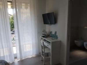 TV a/nebo společenská místnost v ubytování Casa di Kiki
