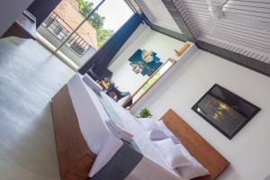 an overhead view of a room with a bed and a fireplace at Western sky in Negombo