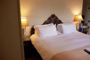Säng eller sängar i ett rum på The Pembroke Arms