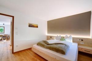 Ένα ή περισσότερα κρεβάτια σε δωμάτιο στο Waalhof Ferienwohnung Golden