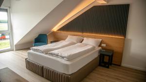 Ein Bett oder Betten in einem Zimmer der Unterkunft RheinApart Hotel und Boardinghouse