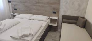 Postel nebo postele na pokoji v ubytování Hotel Altinate