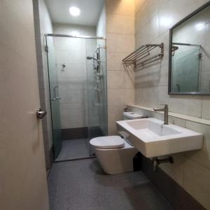 a bathroom with a sink and a shower and a toilet at Octagon Premium Ipoh Town Center 2BR 121 by Grab A Stay in Ipoh +24 photos