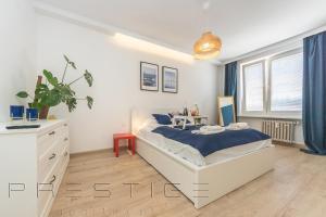 Postel nebo postele na pokoji v ubytování Prestige Apartments Świętojańska