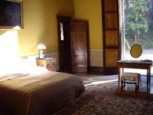 A bed or beds in a room at Villa Benni B&B