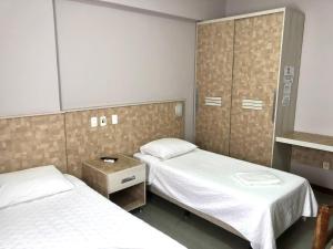 Postel nebo postele na pokoji v ubytování Hotel Rinkao