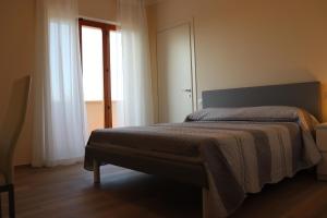A bed or beds in a room at La Casa de Anto'