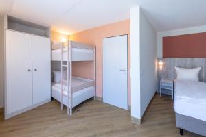 Letto o letti in una camera di Michels Gästehaus Meerzeit