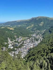 an aerial view of a town in the mountains at Le Martin pêcheur, Appartement proche hyper centre in Le Mont-Dore