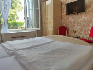 Postel nebo postele na pokoji v ubytování Hotel Dejmalik