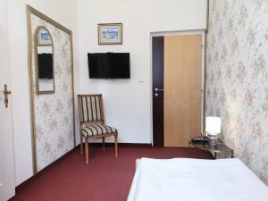Tempat tidur dalam kamar di Hotel Dejmalik