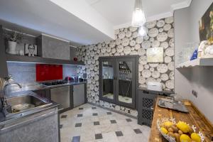 a kitchen with a sink and a counter at Villa Bellavista Evelyne e Giorgio in Pontedassio