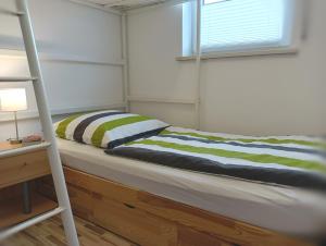 เตียงในห้องที่ Ferienwohnung Pinzenhof - Kemnath