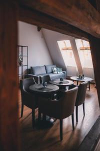 a living room with tables and a couch at ATRIO Apartments 2 in Trenčín