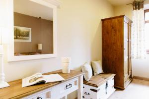 a room with a wooden desk and a mirror at Villa Filmowiec in Polanica-Zdrój +89 photos