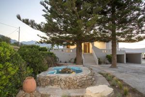 A garden outside Seafront Villa Eirini