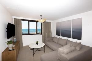 A television and/or entertainment centre at Seafront Villa Eirini