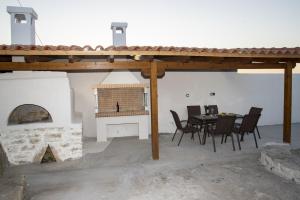 A patio or other outdoor area at Seafront Villa Eirini