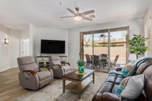 a living room with a couch and chairs and a tv at Cochise #1056 Scottsdale condo in Scottsdale