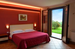 Posteľ alebo postele v izbe v ubytovaní L'Infinito Agriturismo - Rooms & Breakfast