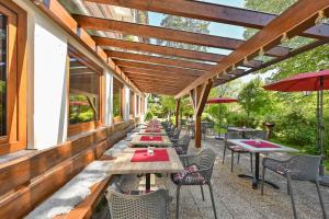 a row of tables and chairs on a patio at Hotel Ruchti - Zeit für mich in Füssen +120 photos