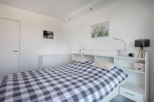 Posteľ alebo postele v izbe v ubytovaní A 30 mètres de la plage bel appartement pour 6