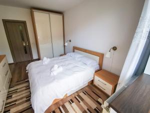 Postel nebo postele na pokoji v ubytování Orchid Luxury Apartment Sinaia