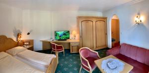 Postel nebo postele na pokoji v ubytování Hotel Neuwirt