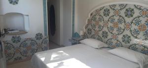 Postel nebo postele na pokoji v ubytování Hotel 4 Stagioni