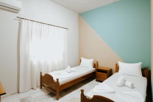 Postel nebo postele na pokoji v ubytování HOTEL LUNXHERIA