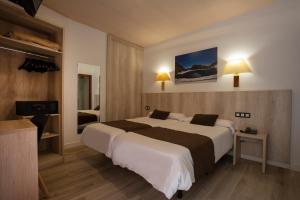 Tempat tidur dalam kamar di Hotel Marco Polo
