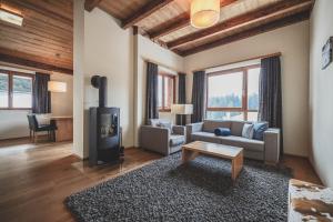 Posezení v ubytování PRIVÀ Alpine Lodge