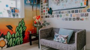 a living room with a couch and a vase of flowers at Garden Lane Backpackers in Dublin