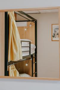 a reflection of a closet in a mirror at Canbe Garden Lane Backpackers in Dublin