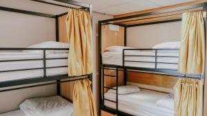 a group of bunk beds in a room at Garden Lane Backpackers in Dublin