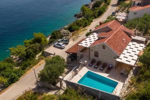 an aerial view of a house with a swimming pool at Villa Endless View in Blato