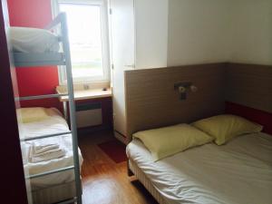 Ένα ή περισσότερα κρεβάτια σε δωμάτιο στο Fasthotel Montereau - Esmans