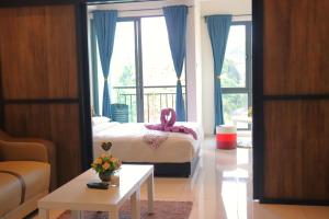 Postel nebo postele na pokoji v ubytování ATS Cameron Hotel & Apartments