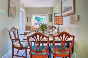 a dining room with a table and chairs at Lovely Lakewood Cottage Near Chautauqua Lake! in Lakewood