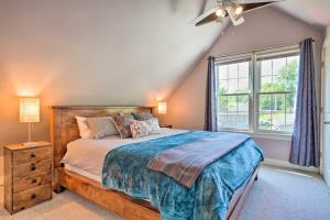 a bedroom with a large bed and a window at Lovely Lakewood Cottage Near Chautauqua Lake! in Lakewood