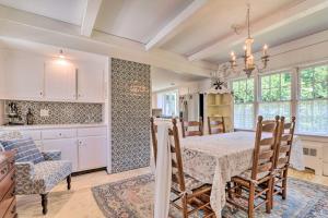 a kitchen and dining room with a table and chairs at Charming Nineteenth-Century Cape Code Escape in Centerville