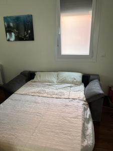 Łóżko lub łóżka w pokoju w obiekcie A de Maria - Tres Marias Apartments