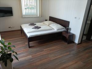A bed or beds in a room at Sentami