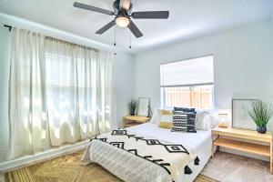 a bedroom with a bed and a ceiling fan at Family-Friendly Clearwater Home with Game Room! in Clearwater